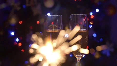 Two Flutes with Sparkling Champagne over Holiday Bokeh Blinking Background 스톡 동영상 259047553
