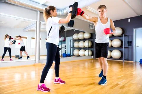 Two focused people training boxing at the fitness gym Foto stock