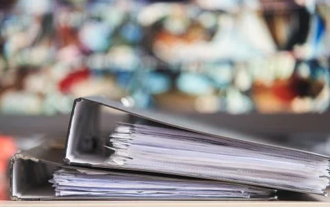 Two folders with documents lie on the table. Stock Photos