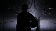 Two Football Players Are Walking Along A Dark Tunnel To The Football Field. View Stock Footage
