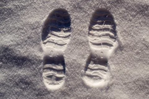 Two Footprints in Snow. Stock Photos
