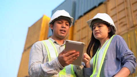 Two foreman checking and control loading containers box from cargo Stock Footage 147399238