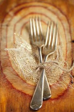 Two fork tied by string on old wood, selective focus, shallow do Stock Photos