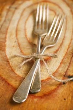 Two fork tied by string on old wood, selective focus, shallow do Stock Photos