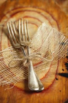 Two fork tied by string on old wood, selective focus, shallow do Stock Photos