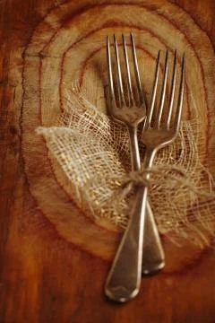 Two fork tied by string on old wood, selective focus, shallow do Stock Photos