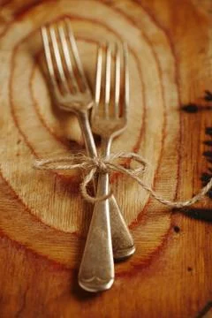 Two fork tied by string on old wood, selective focus, shallow do Stock Photos