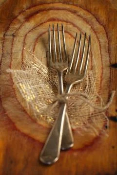 Two fork tied by string on old wood, selective focus, shallow do Stock Photos
