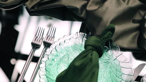 Two forks are lying next to a plate on the table. There will be an event soon Stock Footage 337973080
