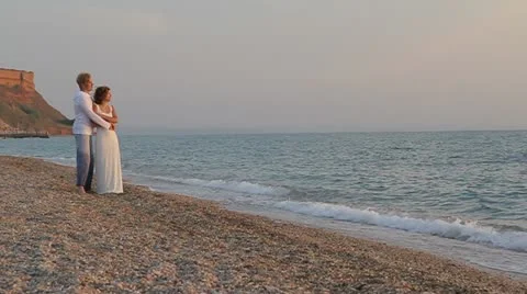 Two frames: Young Family On The Beach Stock Footage 22423949