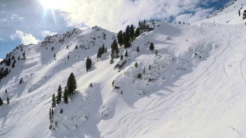Two freerider skier skiing on the prepared slope with fresh new powder snow in A Stock-Footage 73854968