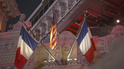 Two French flags and one US flag suspended Stock Footage 336669595
