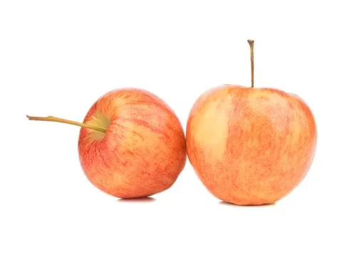 Two fresh apples with stems on a white background Stock Photos