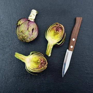 Two fresh artichokes Stock Photos