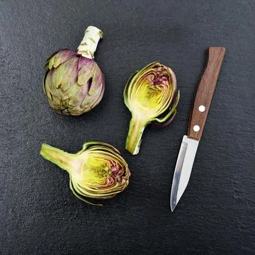 Two fresh artichokes Stock Photos