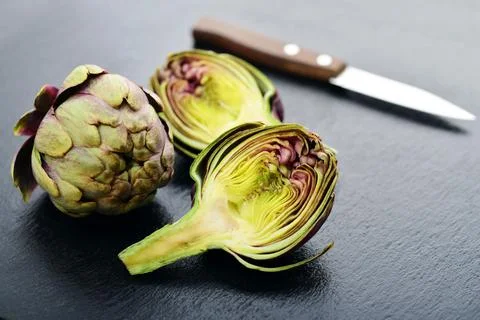 Two fresh artichokes Stock Photos