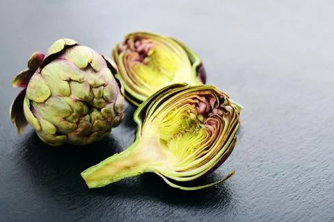 Two fresh artichokes Stock Photos