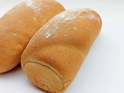 Two fresh bread rolls isolated on white background Stock Photos