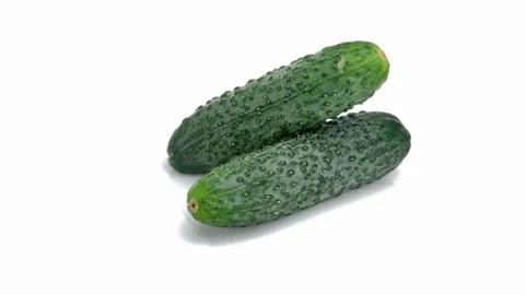 Two fresh cucumbers isolated on white background. 4K Footage Stock Footage 245957943