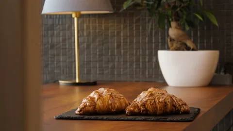 Two fresh delicious croissants on the table 스톡 동영상 168172833
