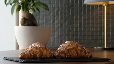 Two fresh delicious croissants on the table 스톡 동영상 168178712