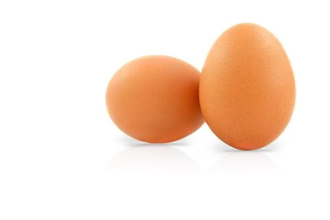 Two fresh eggs isolated on a white background. Stock Photos