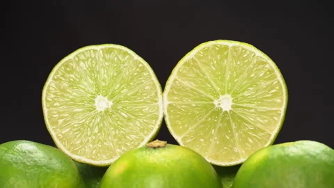 Two Fresh Lime Halves Standing Still On Black Background Stock Footage 323360263