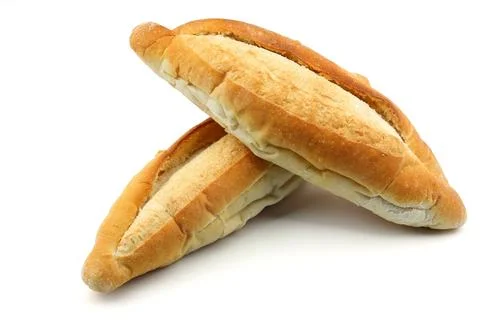 Two fresh loaves of bread stacked on white background Stock Photos