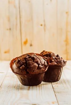 Two fresh muffins with chocolate chip Stock Photos