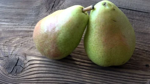 Two fresh pears on wooden table 스톡 동영상 137028845
