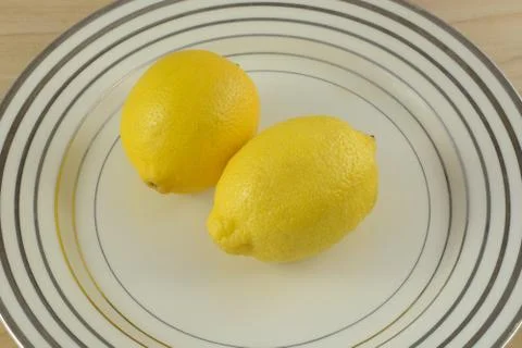 Two fresh raw lemons Stock Photos