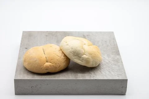 Two fresh rolls on a plate Stock Photos