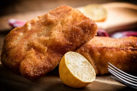 Two fried cod fillet pieces. Stock Photos