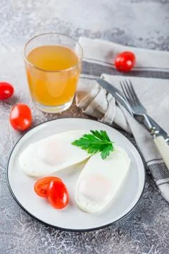 Two fried eggs for breakfast . Stock Photos