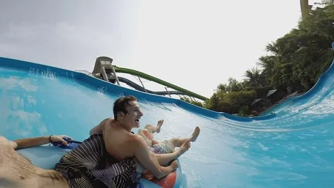 Two friends are riding on an inflatable lap Stock Footage 80534633