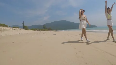 Two friends are walking along the seashore Video stock 237731319