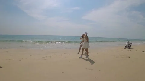 Two friends are walking along the seashore Stock-Footage 237731345