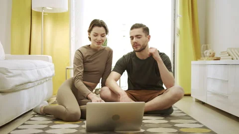 Two friends are watching something on the computer Stock Footage 156302091