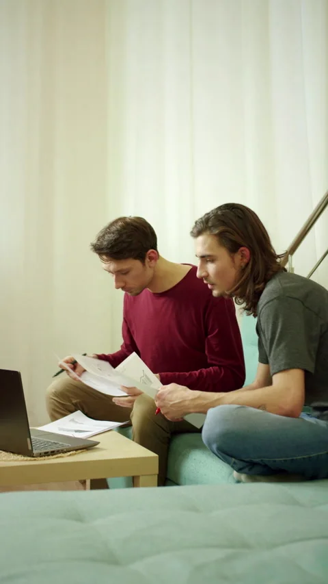 Two friends are working and looking through documents Stock Footage 159348945