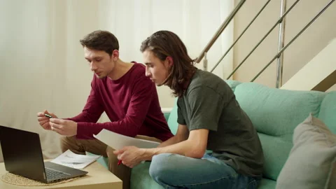 Two friends are working and looking through documents Stock Footage 160175137