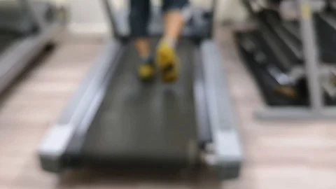 Two friends are working out to maintain their health by running on the treadmill Stock Footage 126081490