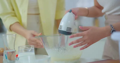 Two friends baking in the kitchen. Video stock 272340840
