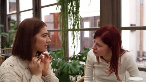 Two friends in a cafe  Stock Footage 320827331