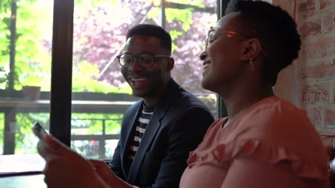 Two friends at coffee shop using digital tablet Stock Footage 155808945