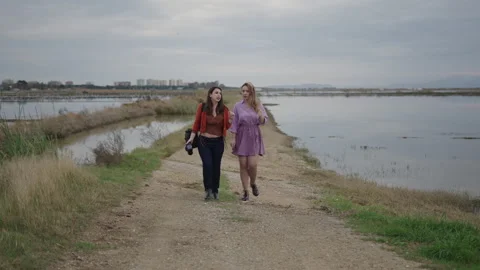 Two friends comment on something as they walk up to each other Video stock 280212014