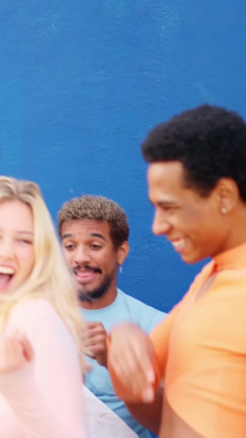 Two friends dancing next to multi-ethnic friends outdoors Stock Footage 265754747