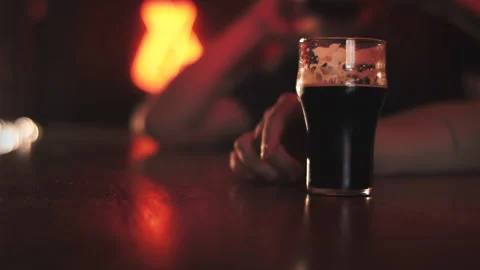 Two friends drinking beer in a bar Stock Footage 202377920