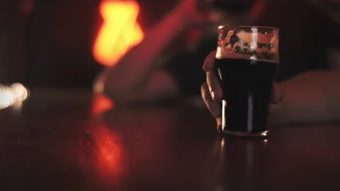 Two friends drinking beer in a bar Stock Footage 212434807