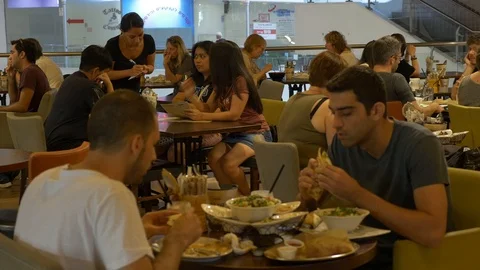 Two Friends Eat In A Risotrante Tel avv, Israel Stock Footage 90419195