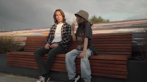 Two friends, the eldest and the youngest, communicate and spend time together. Stock Footage 299346491